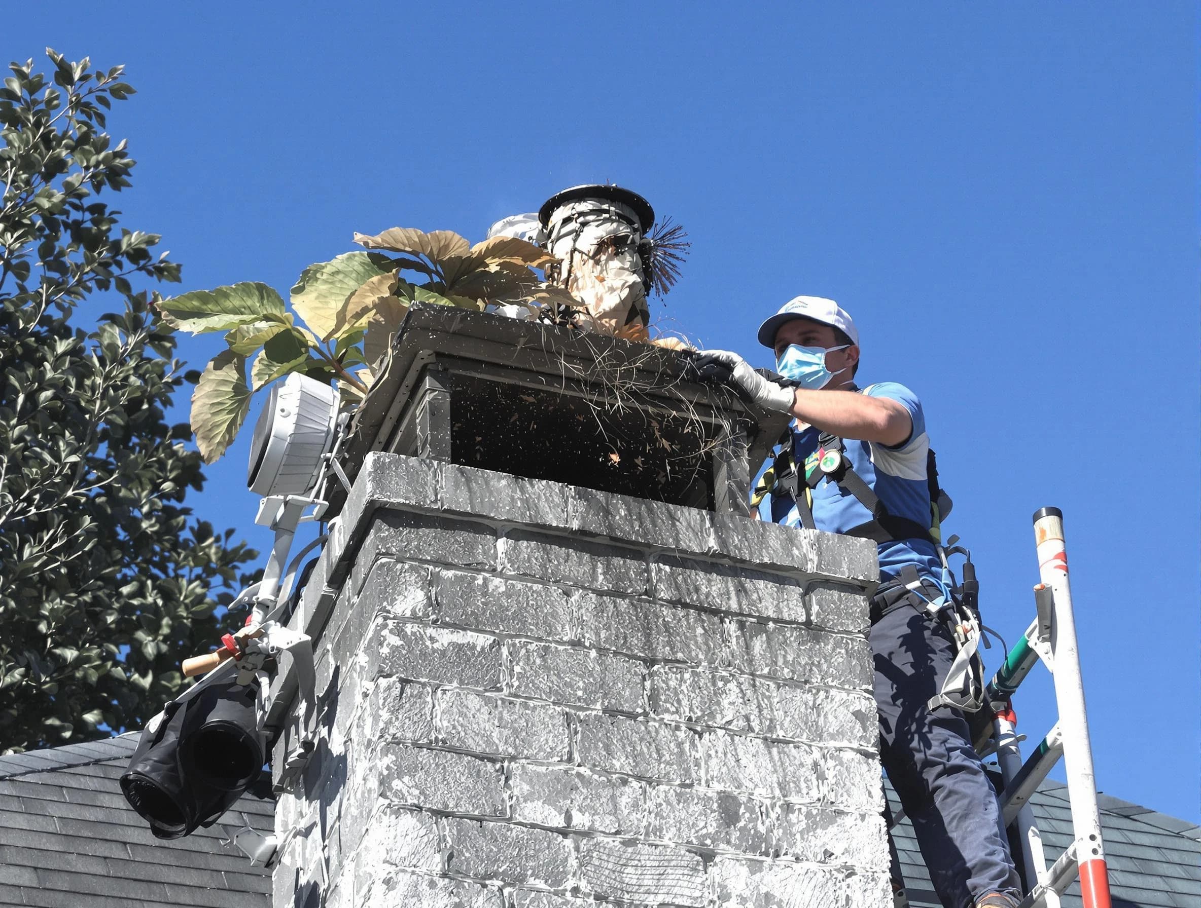 Neptune Chimney Sweep specialist performing chimney cleaning in Neptune, NJ